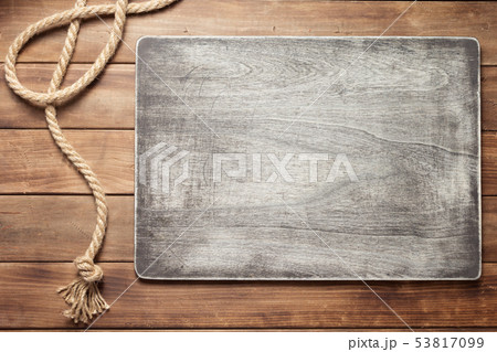 ship rope at wooden board background 53817099