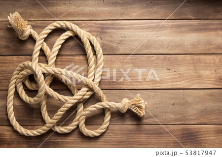 ship rope at wooden background texture 53817947