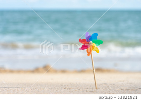 Colorful windmill paper embroidered on the beach Colorful windmill paper embroidered on the beach 53821921