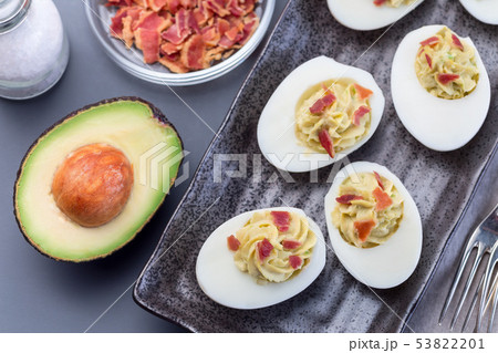 Deviled eggs stuffed with avocado, egg yolk Deviled eggs stuffed with avocado, egg yolk 53822201