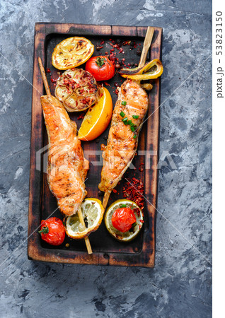 Grilled salmon on cutting board Grilled salmon on cutting board 53823150
