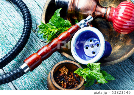 Smoking hookah with mint Smoking hookah with mint 53823549