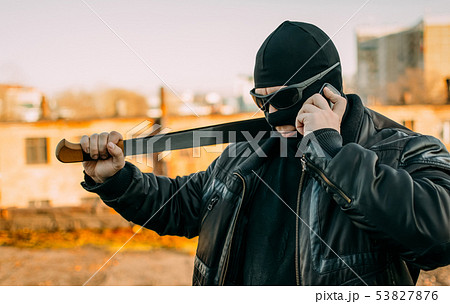 bandit with a machete in a black mask bandit with a machete in a black mask 53827876