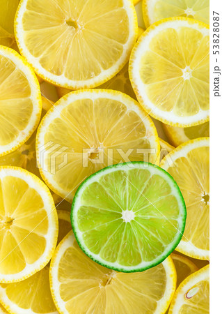 Lemon slices with one cut lime slice closeup 53828087