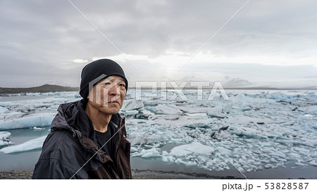 Asian senior man with Iceland glacier amazing 53828587