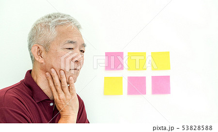 Asian senior man expression worry note paper. copy 53828588