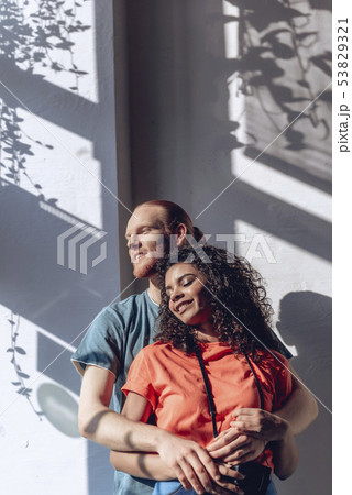 Happy guy is embracing beloved girl indoors 53829321