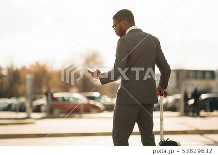 Businessman Ordering Taxi, Using Mobile Phone App 53829632