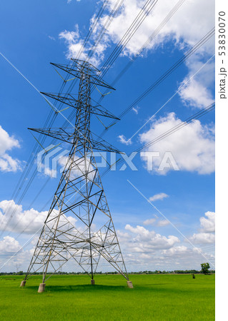 high voltage pole on wihte cloudy and blue high voltage pole on wihte cloudy and blue 53830070