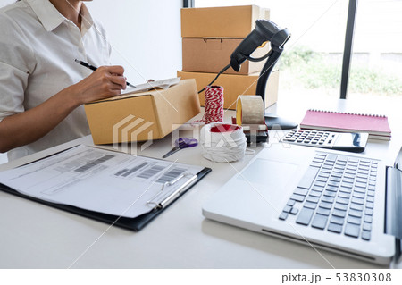 Young entrepreneur SME receive order client and Young entrepreneur SME receive order client and 53830308