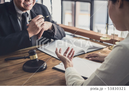 Male lawyer or judge consult having team meeting Male lawyer or judge consult having team meeting 53830321