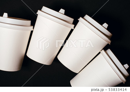 Four paper cups on black background 53833414