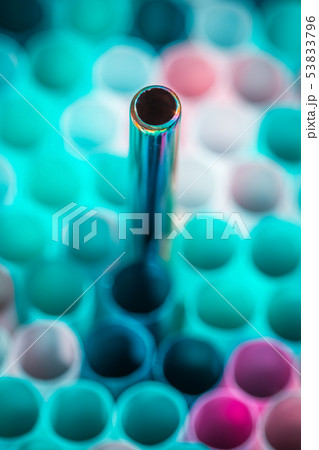Metal drinking straw between othe ordinary plastich ones. Ecology zero waste concept. Metal drinking straw between othe ordinary plastich ones. Ecology zero waste concept. 53833796