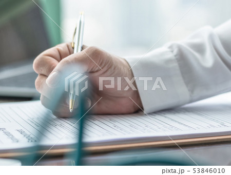 Applicant filling in company application form job 53846010