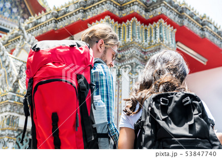 Backpackers traveling at ancient Thai temple Backpackers traveling at ancient Thai temple 53847740