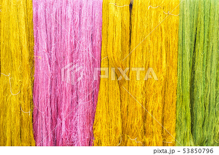 Thai silk threads fiber background in pink, green Thai silk threads fiber background in pink, green 53850796