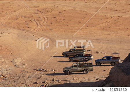 Bedouin's car jeeps and tourists, Wadi Rum desert Bedouin's car jeeps and tourists, Wadi Rum desert 53851280