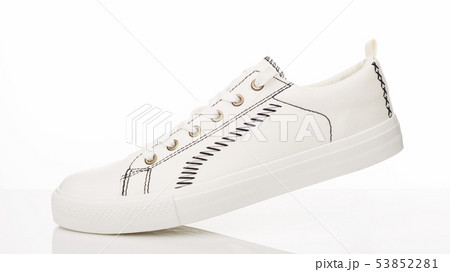 Fashionable white walking shoes on a white 53852281