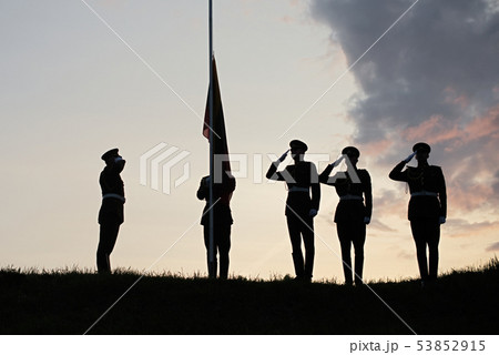 Soldiers Raising The Lithuanian Flag At Sunset 53852915