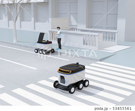 交差点を通過する配送ロボット。その近くにスマホアプリで配送ロボットから荷物を受け取る人がいる 53855561
