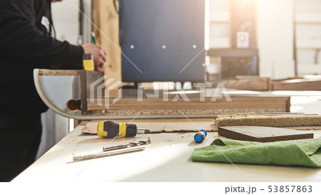 Cropped shot of craftsman working at his workstation 53857863