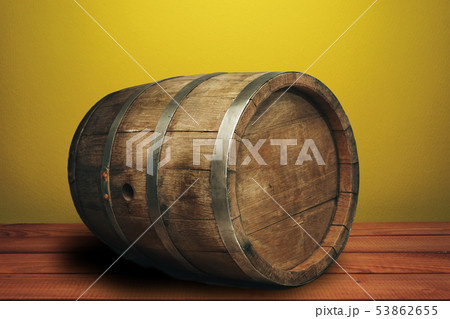 Beautiful wooden barrel on a red wood table and Beautiful wooden barrel on a red wood table and 53862655