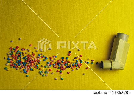 Yellow asthma inhaler with particle aerosol spay Yellow asthma inhaler with particle aerosol spay 53862702