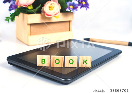 Book text on Wood block sign on mobile tablet for Book text on Wood block sign on mobile tablet for 53863701