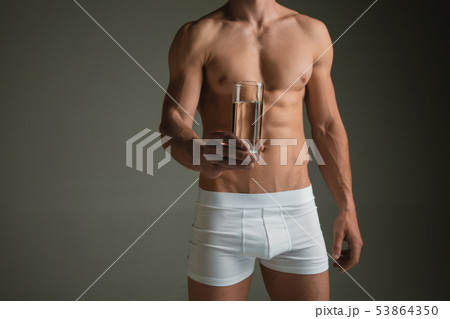 Perfect slim toned young body of the man Perfect slim toned young body of the man 53864350