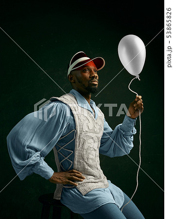 Young man as a medieval knight on dark background Young man as a medieval knight on dark background 53865826