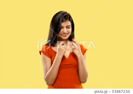 Portrait of beautiful woman isolated on yellow studio background Portrait of beautiful woman isolated on yellow studio background 53867230