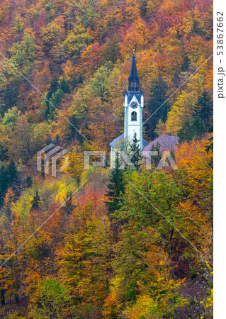 Church in Slovenia countryside, autumn trees 53867662