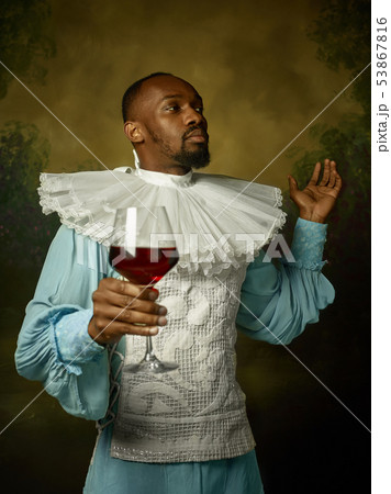 Young man as a medieval knight on dark background Young man as a medieval knight on dark background 53867816
