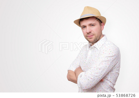 Confident young man standing isolated over white 53868726