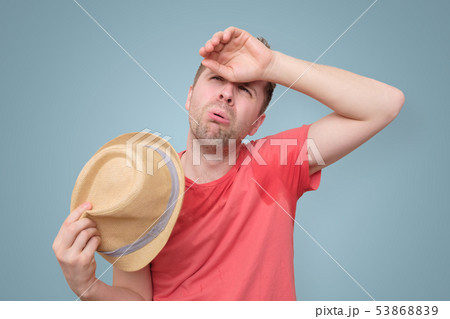 Man is worried and tired because of sweating stain Man is worried and tired because of sweating stain 53868839