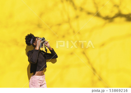African girl photographer making picture in street 53869216
