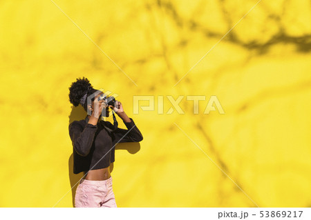 African girl photographer making picture in street 53869217