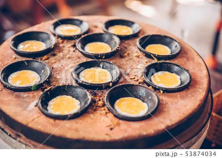 Vietnamese mini fried eggs, cooking on the street - Traditional Vietnamese food Vietnamese mini fried eggs, cooking on the street - Traditional Vietnamese food 53874034