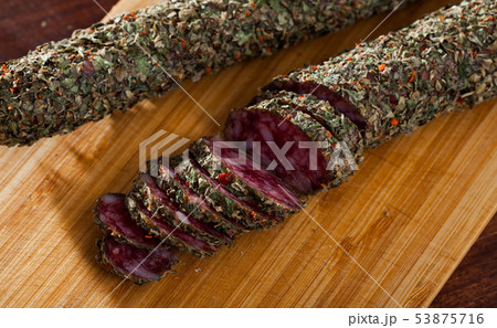 Sliced spanish sausage fuet with herbs Sliced spanish sausage fuet with herbs 53875716