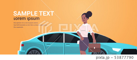 businesswoman standing near luxury car african american woman in formal wear holding suitcase going 53877790