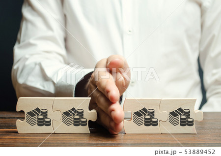 Businessman separates the wooden puzzle Businessman separates the wooden puzzle 53889452