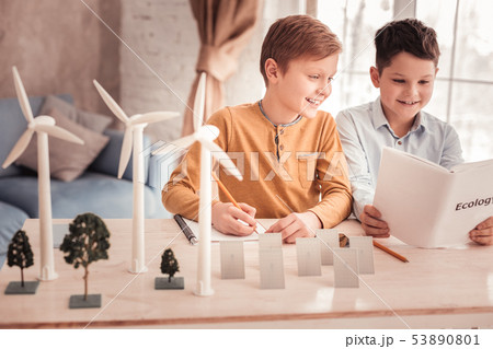 Two beaming schoolboys speaking about ecology 53890801