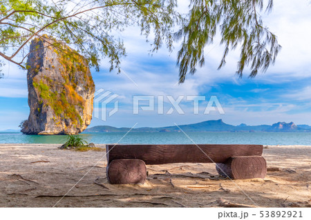 Beach chairs and palms on the beautiful beach Beach chairs and palms on the beautiful beach 53892921