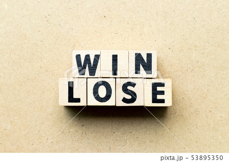 Letter block in word win lose on wood background Letter block in word win lose on wood background 53895350