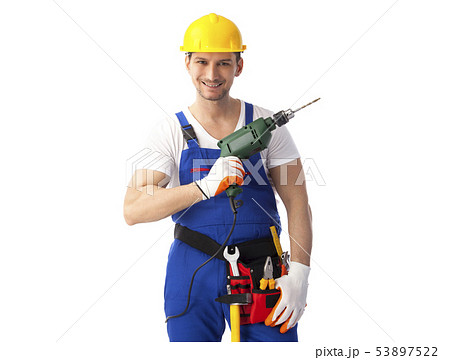 Smiling handyman holding drill machine 53897522