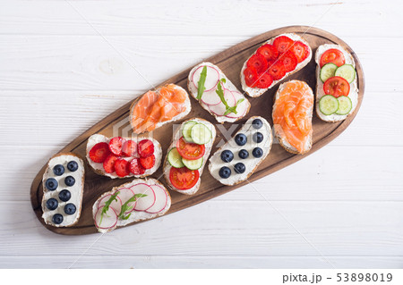 Variation of toast with fruit , vegetable and 53898019
