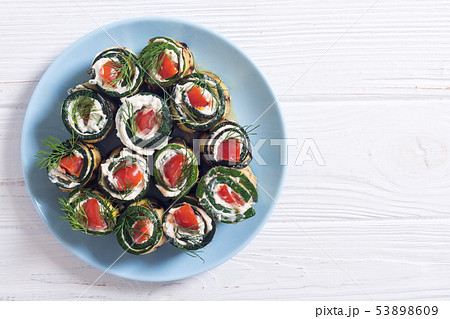Zucchini rolls with cream cheese , tomatoes and Zucchini rolls with cream cheese , tomatoes and 53898609