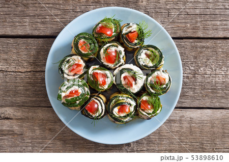 Zucchini rolls with cream cheese , tomatoes and Zucchini rolls with cream cheese , tomatoes and 53898610