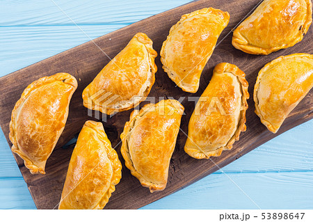 Latin American baked beef empanadas with sauce Latin American baked beef empanadas with sauce 53898647