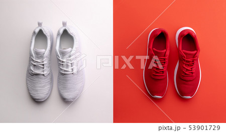 A studio shot of running shoes on bright color background. Flat lay. 53901729